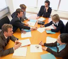 Consultants working around a desk