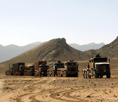 Military convoy ferrying supplies across desert