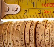 Pound coins and a tape measure