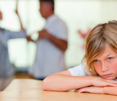 Child leaning on table