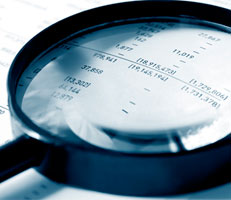 Magnifying glass and accounts