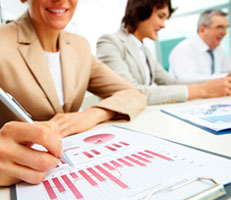 Office workers looking at paperwork