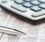 Pen, calculator and accounts