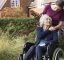 Patient in wheelchair with carer