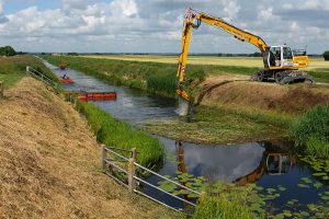 Digger in ditch