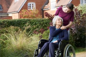 Lady in wheelchair with carer