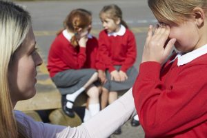 School children and teacher in playground