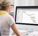 woman looking at gantt chart on a computer