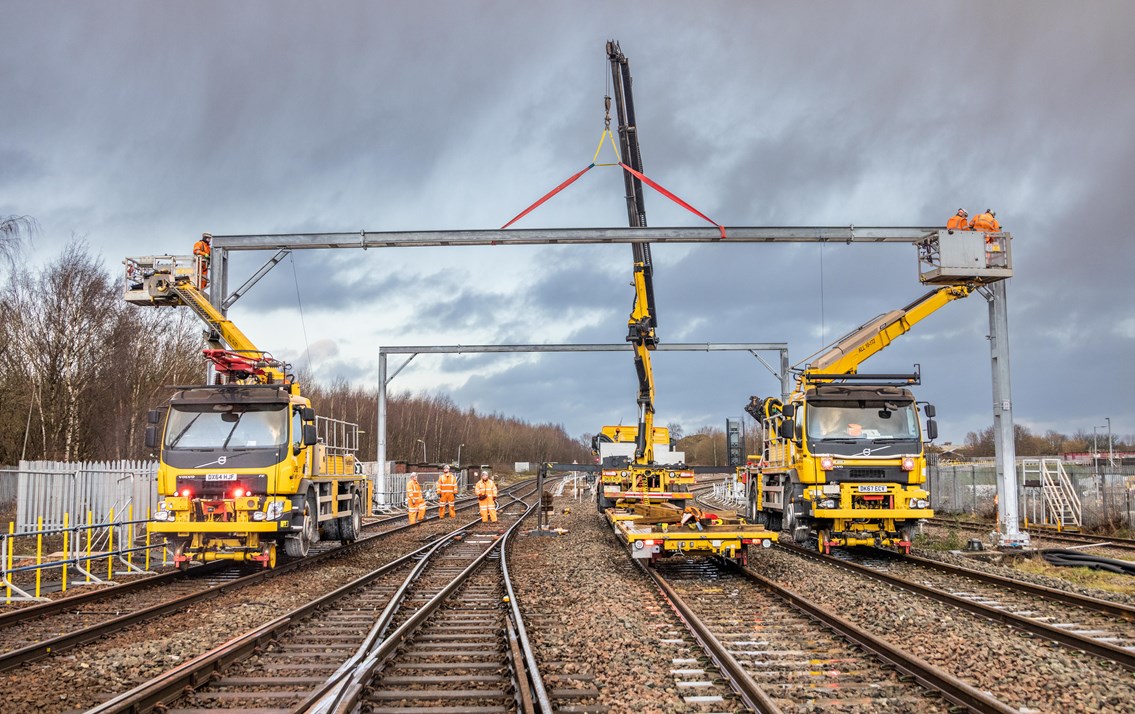 Yellow engineering machinery on railway tracks