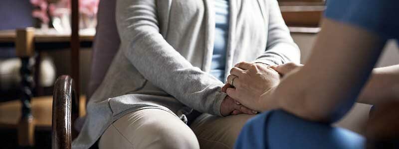 Holding hands in a social care setting