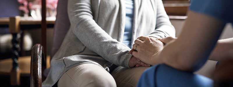 Holding hands in a social care setting