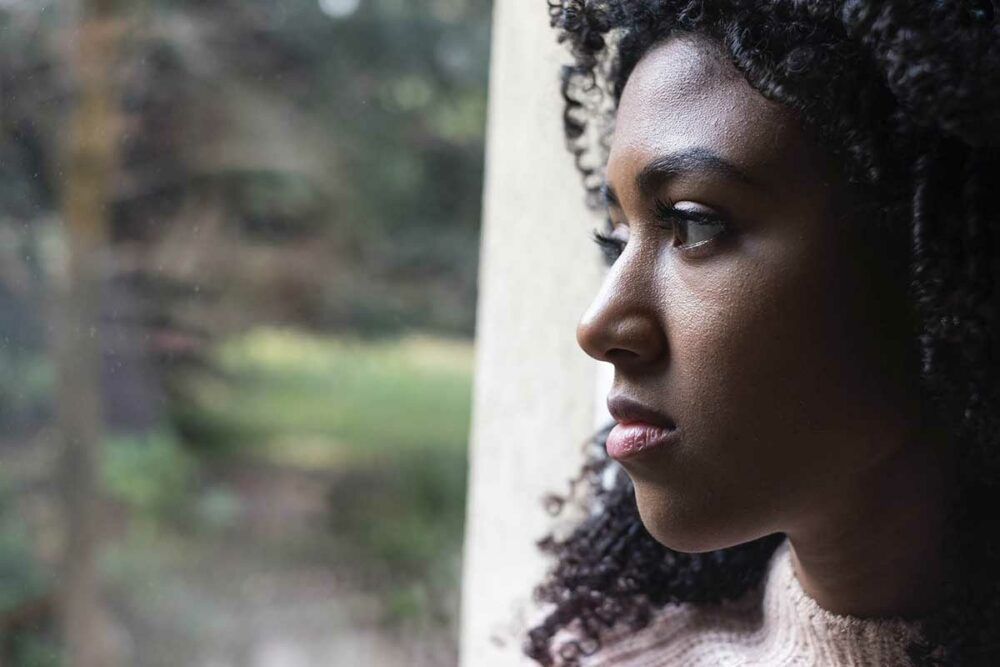 Woman looking out of a window