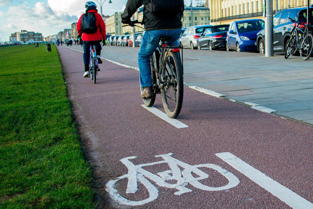 People riding bikes on a cycle path