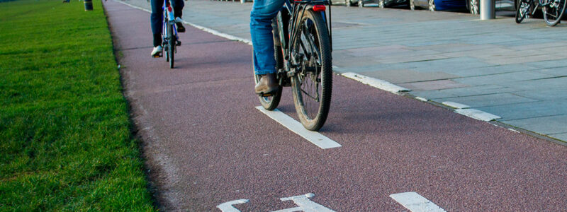 People riding bikes on a cycle path