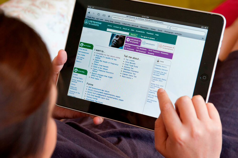 Person using the HMRC website on a tablet device