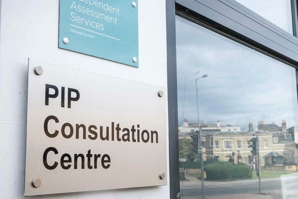 Building exterior with sign reading PIP Consultation Centre