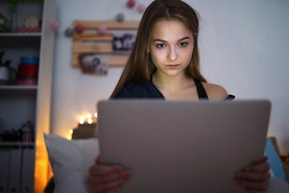 Teenage girl using a laptop