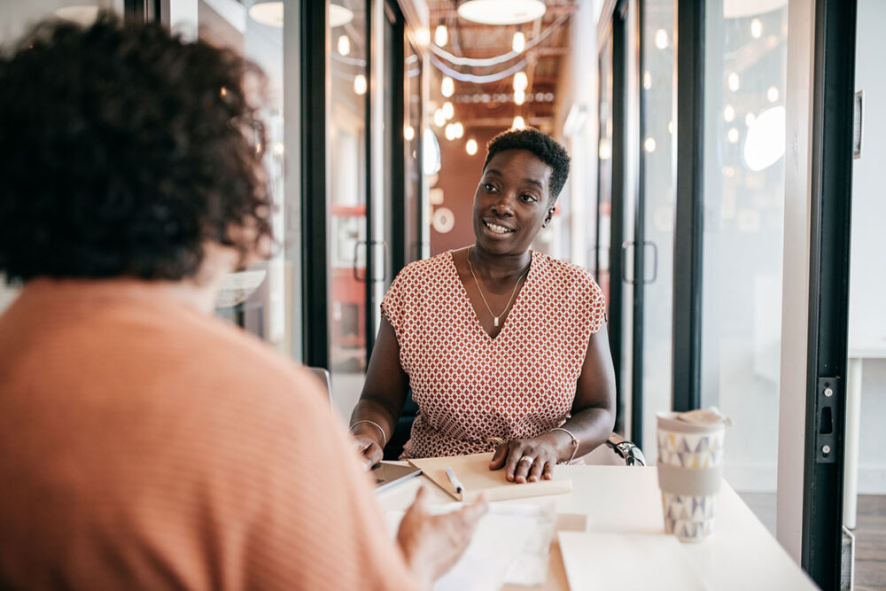 Two women having a meeting in a modern office