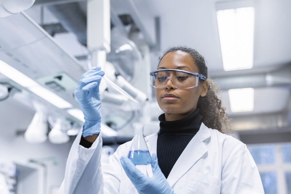 Female scientist working with chemicals in a lab